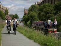 Cyclists on a canal tow path Cyclists on a canal tow path